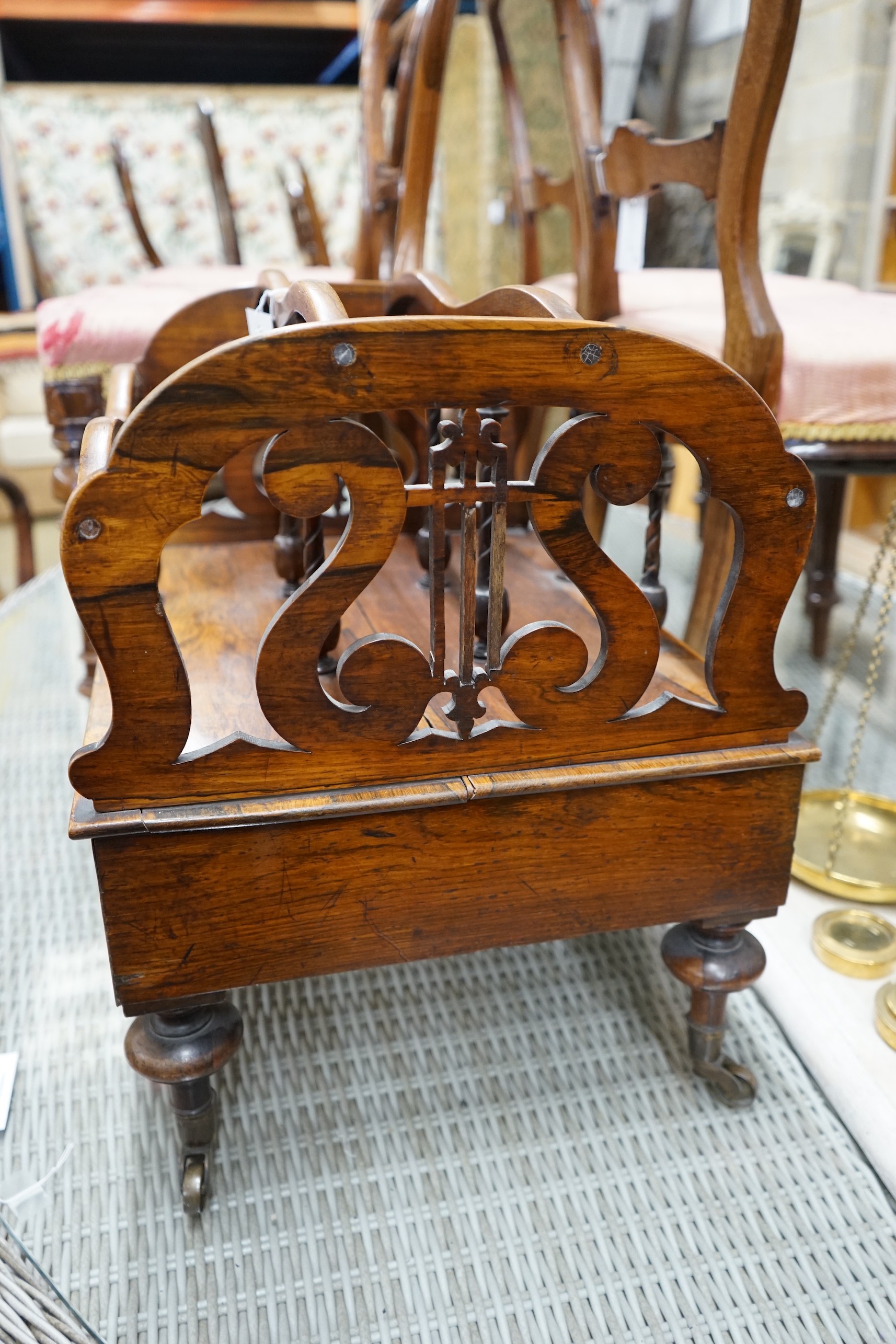 A Victorian rosewood three division Canterbury, width 52cm, depth 40cm, height 48cm